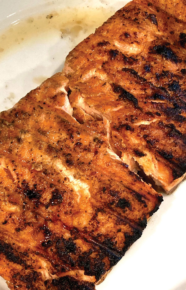 Charcoal Grilled Salmon shown on serving plate.