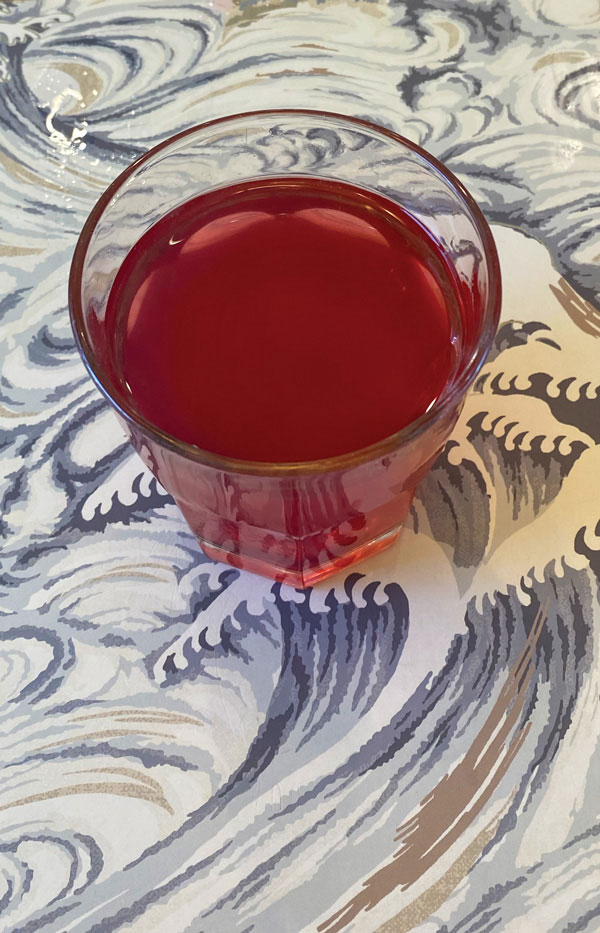 "Pretty in Magenta" Tea shown in a glass.